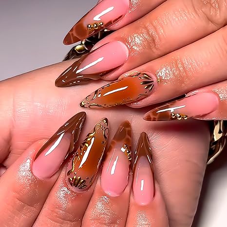 Le Posh Nail Spa — pink and brown French tip nail art with gold accents
